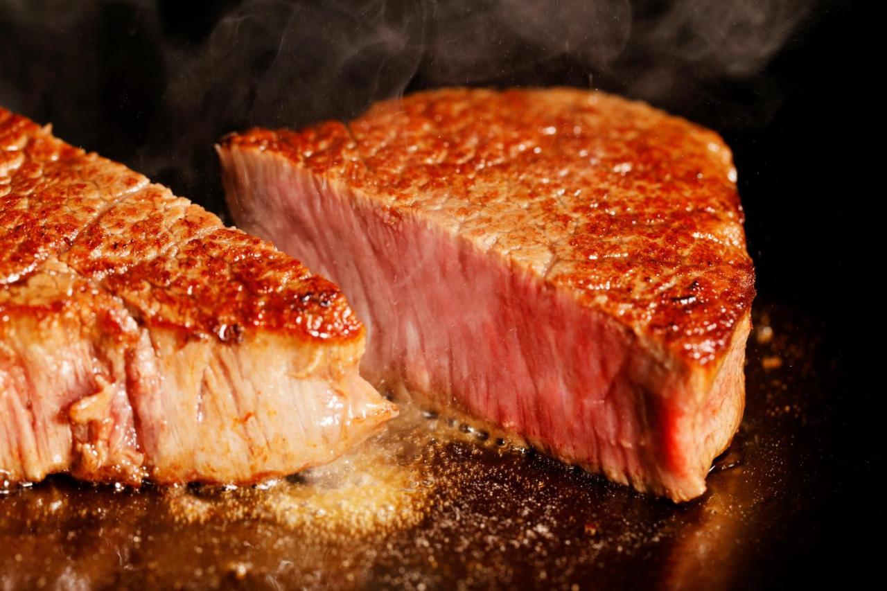 Hotel Nikko Kanazawa Bagian luar foto A steak being cooked